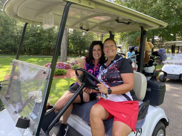 Golf twosome in golf cart at Skyland Camp Golf Retreat